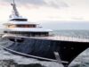 Travel Experts Reveal Amazing Benefits of Upholstery for Boat Interiors Large luxury motor yacht with a dark hull cruises the open sea at sunset, multi-deck white superstructure visible.