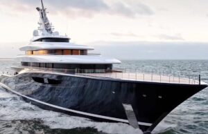 Travel Experts Reveal Amazing Benefits of Upholstery for Boat Interiors Large luxury motor yacht with a dark hull cruises the open sea at sunset, multi-deck white superstructure visible.