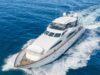 Amazing Benefits of Reupholstering a Boat Every Owner Should Know White luxury motor yacht cruising through deep blue ocean, creating a frothy wake.