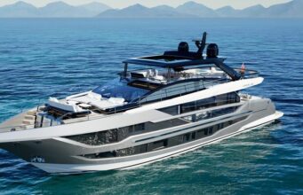 Amazing Best Boat Upholstery Styles That Transform Every Boat Luxury motor yacht cruising on calm blue sea with distant mountains on the horizon.