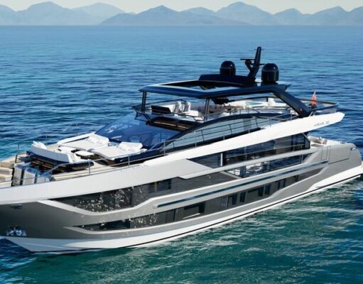 Amazing Best Boat Upholstery Styles That Transform Every Boat Luxury motor yacht cruising on calm blue sea with distant mountains on the horizon.
