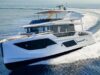 Reupholstering Boat Seat Gives Boats a Fresh New Look White luxury motor yacht cruising at speed through blue water, creating a white wake behind it.